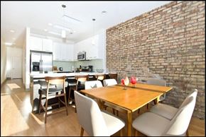 Chicago apartment for rent - a dining room and kitchen with a table and chairs