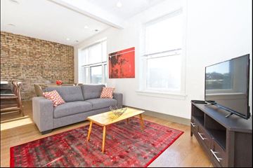 Chicago apartment for rent - a living room with a couch and a television