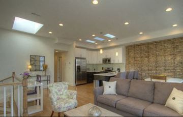 Chicago apartment for rent - a living room with a couch and a kitchen