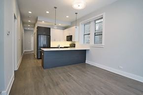 Chicago apartment for rent - an empty kitchen with a counter top in a house