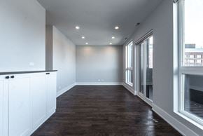 Chicago apartment for rent - a living room with a wood floor and a large window