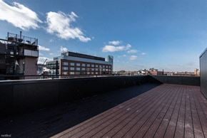 Chicago apartment for rent - the roof of a building with a city in the background
