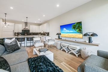 Chicago apartment for rent - a living room with a kitchen and a couch and a table