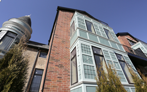Chicago apartment for rent - the facade of a brick building with a water tower
