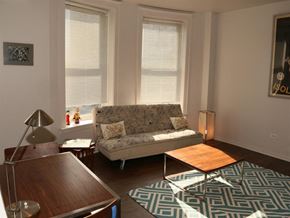 Chicago apartment for rent - a living room with a couch and a table