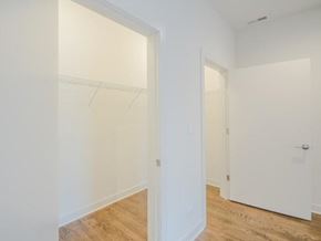 Chicago apartment for rent - an empty bedroom with white walls and a wood floor