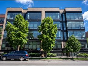 Chicago apartment for rent - a blue van parked in front of a building