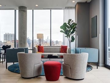 Chicago apartment for rent - a living room filled with furniture and a large window