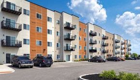 Kokomo apartment for rent - an apartment building with cars parked in front of it
