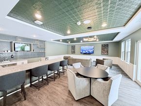 Westfield apartment for rent - A modern dining room with a bar area and a television mounted on the wall.