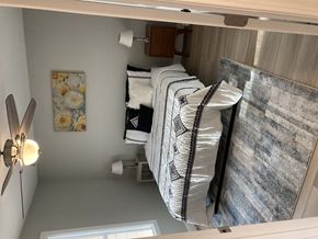 Laconia apartment for rent - a small bedroom with a bunk bed and a mirror