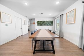 Cedar Rapids apartment for rent - a long wooden table with black chairs in a room with white walls  at Union at Wiley, Iowa, 52404