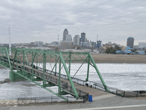 Des Moines apartment for rent - A bridge over a river with a city skyline in the background near Union at Rivers Edge Apartments, Des Moines