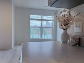 Des Moines apartment for rent - A kitchen with a table, vase, and candle at Union at Rivers Edge Apartments, Des Moines