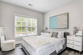 Newburgh apartment for rent - a bedroom with a bed and two windows