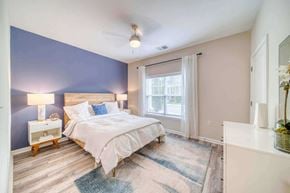 Suffolk apartment for rent - a bedroom with a bed and a window at Meridian Obici, Suffolk Virginia