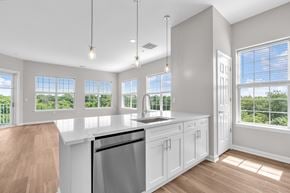 Raritan apartment for rent - A kitchen with white cabinets and a stainless steel dishwasher.