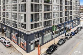 Baltimore apartment for rent - A street view of a building with cars parked in front.at 222 Saratoga, Maryland