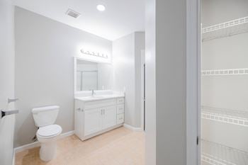 A white bathroom with a toilet