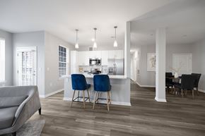 Bayonne apartment for rent - A modern kitchen with a dining table and chairs at Harbor Pointe Apartments, Bayonne, NJ, 07002