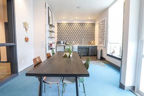 Denver apartment for rent - A dining room with a wooden table and chairs at RiDE at RiNo Apartments, Denver, CO