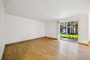 Salem apartment for rent - A room with a wooden floor and a sliding glass door.