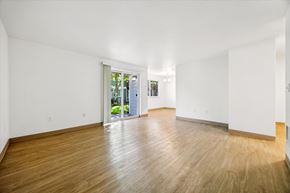 Salem apartment for rent - A room with wooden floors and white walls.