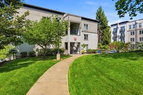 Portland apartment for rent - A building with a green lawn in front of it.