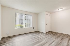 Milwaukie apartment for rent - A room with a window and wooden flooring.