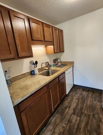 Beaverton apartment for rent - A kitchen with brown cabinets and a granite countertop.