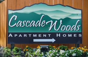 Aloha apartment for rent - the sign for cascade woods apartment homes