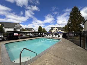Hillsboro apartment for rent - A small pool with a metal ladder in the middle of it.