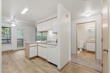 Portland apartment for rent - A kitchen with white cabinets and a sink.