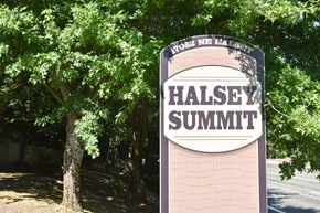 Portland apartment for rent - a sign that says halley summit with trees in the background