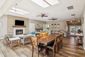 Salem triplex for rent - A dining room with a wooden table and chairs.