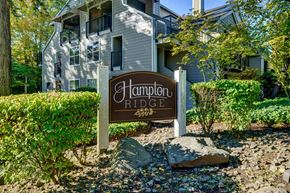 Tigard apartment for rent - Hampton Ridge sign in front of a building.