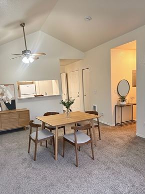Hillsboro apartment for rent - A dining room with a wooden table and chairs.