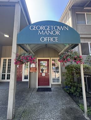 Tigard apartment for rent - The entrance to the Georgetown Manor Office is adorned with flowers.