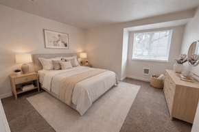Tualatin apartment for rent - A bedroom with a large bed and a window.