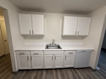 Tualatin apartment for rent - A kitchen with white cabinets and a sink.