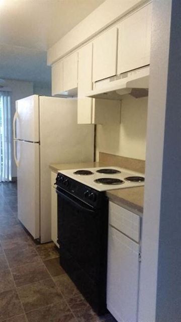 Gresham apartment for rent - a kitchen with a stove and a refrigerator