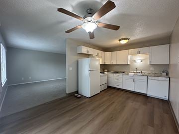 Hillsboro apartment for rent - A kitchen with white cabinets and a white refrigerator.