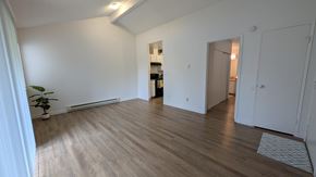 Scappoose apartment for rent - A room with wooden floors and white walls.