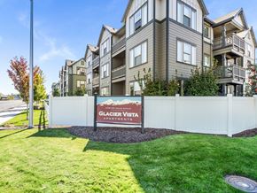 Redmond apartment for rent - A sign for Glacier Vista Apartments is in front of a building.