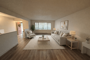 Beaverton townhouse for rent - A living room with a white couch, a coffee table, and a small potted plant.