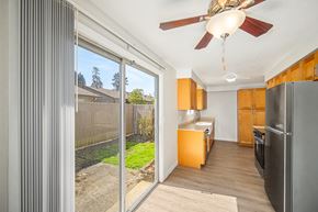 Salem apartment for rent - A kitchen with a refrigerator, oven, and a ceiling fan.