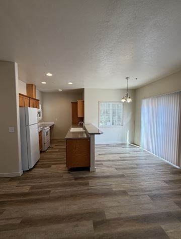 Beaverton apartment for rent - A kitchen with a refrigerator, dishwasher, and sink.