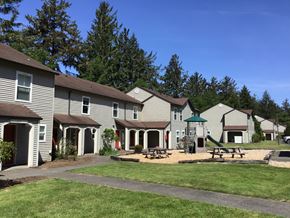 Hammond apartment for rent - A row of houses with a green lawn in front.