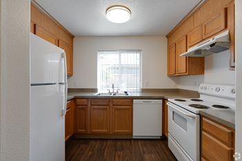 <B>gourmet kitchen:</b>  equipped with dishwashers, garbage disposals, and plenty of counter space.