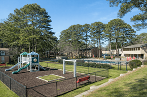 College Park apartment for rent - A playground with a slide, swings, and a basketball hoop.